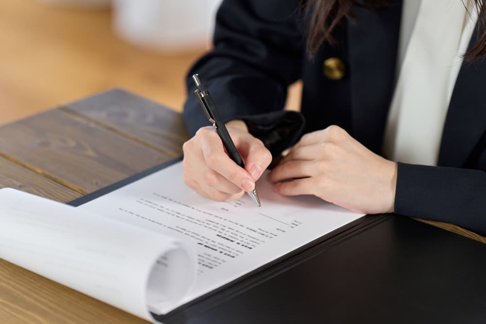 A Medical Negligence Lawyer working in her office