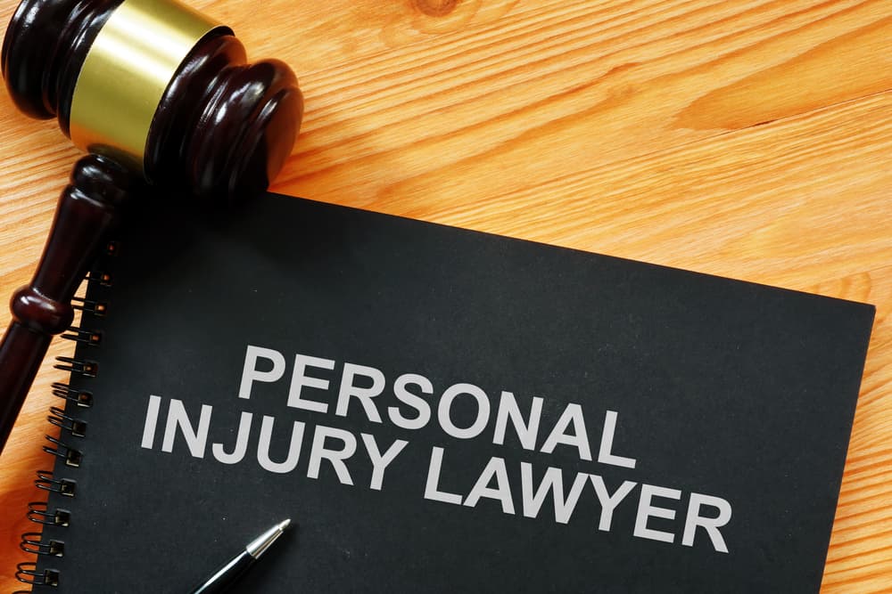 A conceptual photo featuring the printed text "Personal Injury Lawyer," symbolizing legal representation and expertise in personal injury cases.