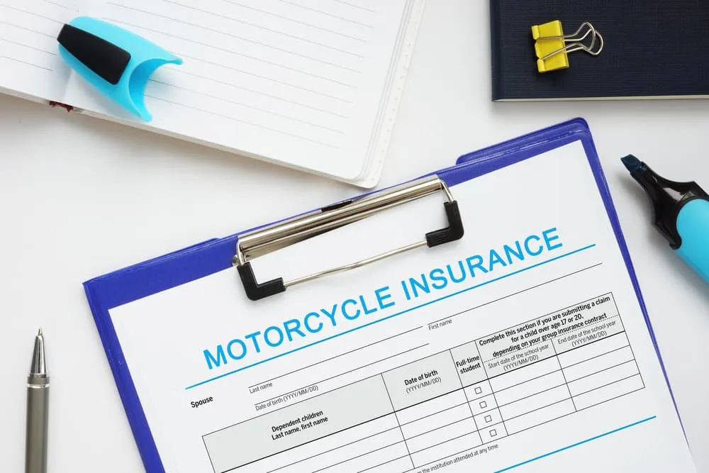 MOTORCYCLE INSURANCE with inscription on the financial document
