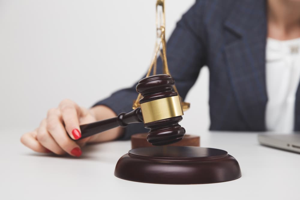 Woman lawyer with wooden gavel