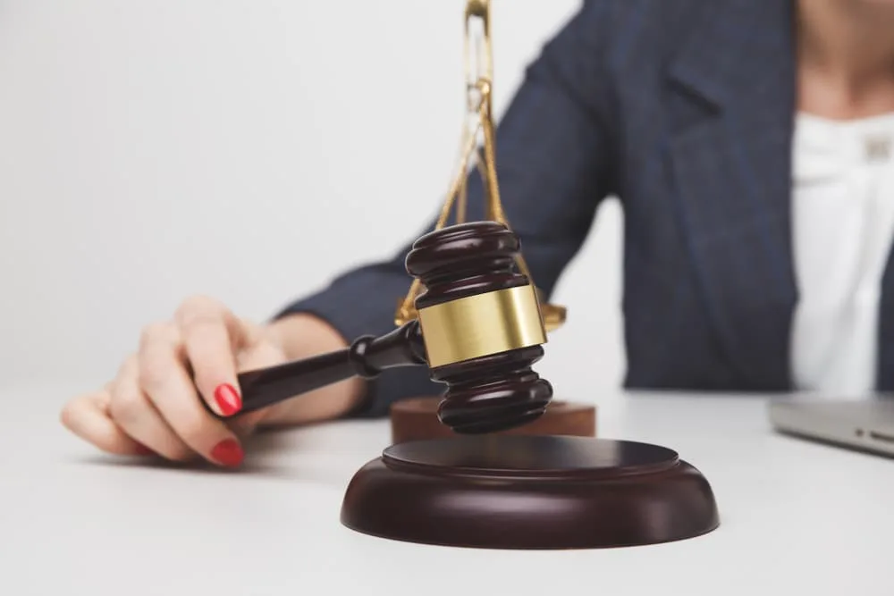 Woman lawyer with wooden gavel