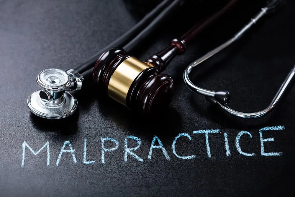 Medical Malpractice Showing Gavel And Stethoscope