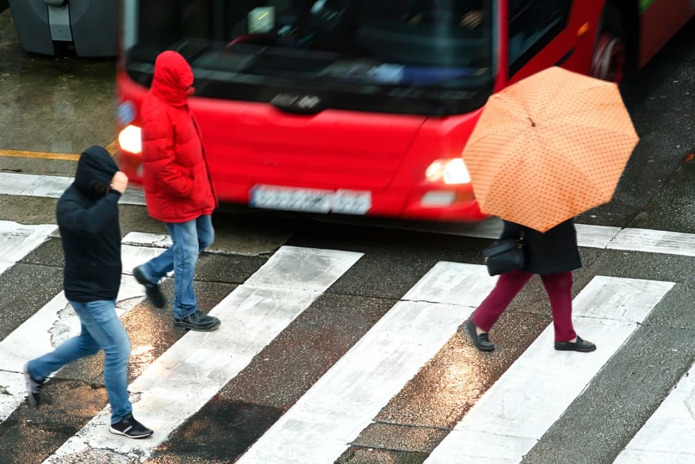People pedestrian  in dangerous situation in crosswalk in city street by vehicles at high speed