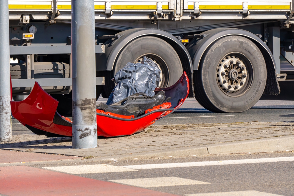 Debris from a commercial truck accident showing the severe damage caused by a large truck crash