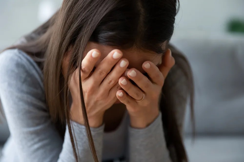 Woman grieving the loss of a loved one after a wrongful death