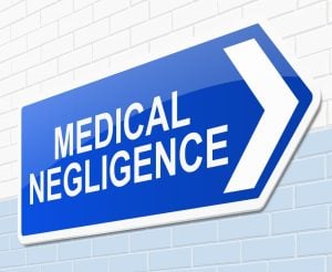 A blue directional sign with the words "Medical Negligence" in white capital letters and a white arrow pointing to the right.